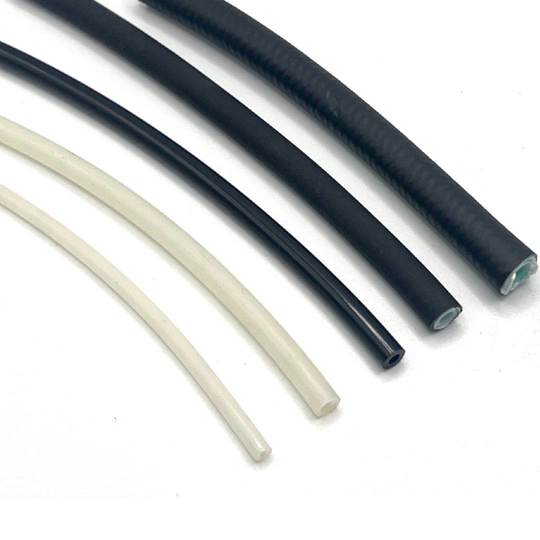 An array of grease and oil tubes and hoses, including 6mm Nylon Tube, 10mm Heavy Wall Tube, Stainless Tube, and High Pressure Hose, designed for optimal lubrication in demanding industrial environments